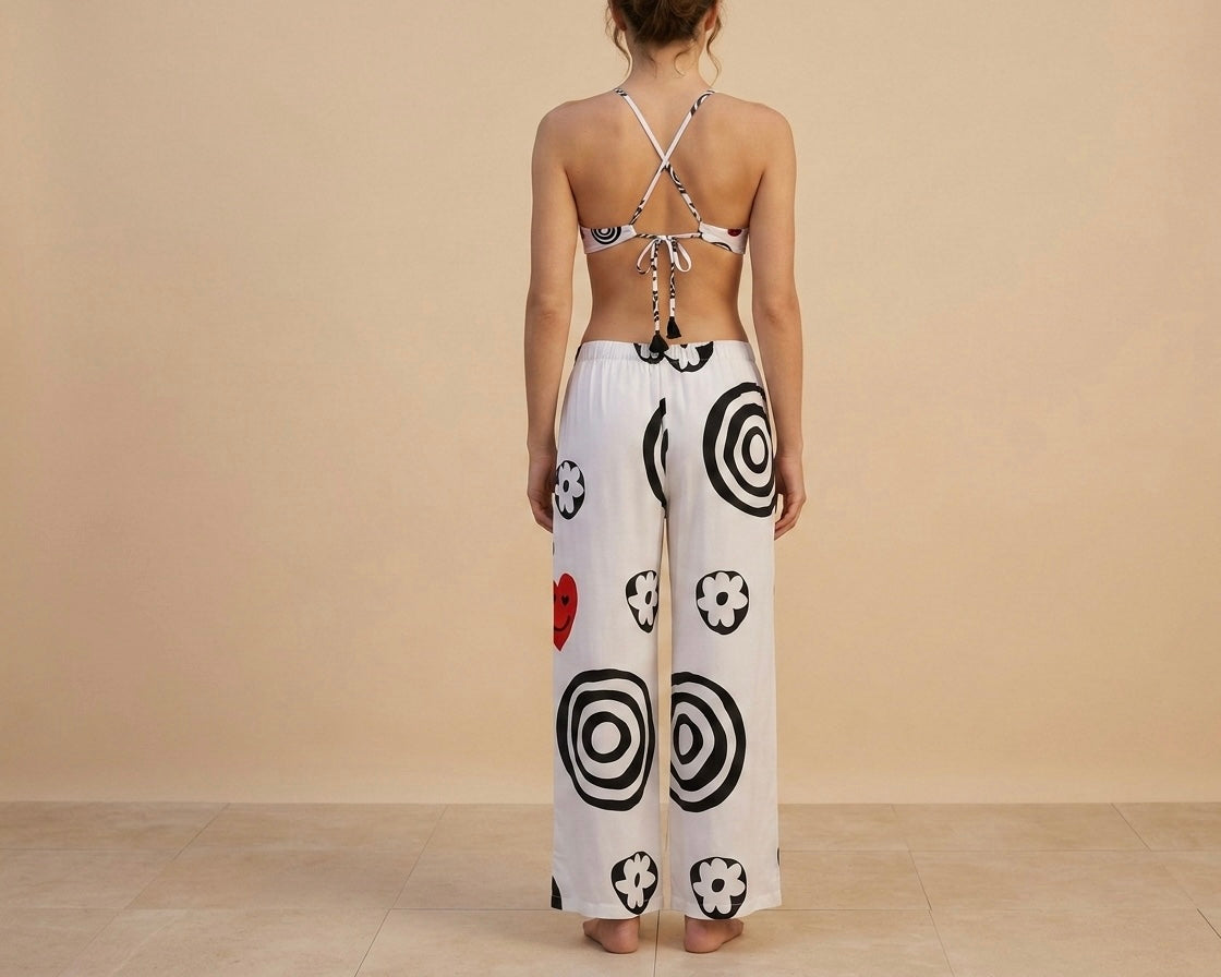 Pantaloni palazzo donna moda mare resortwear fatti a mano Made in Italy, ana lascarro beachwer, foto parte dietro.